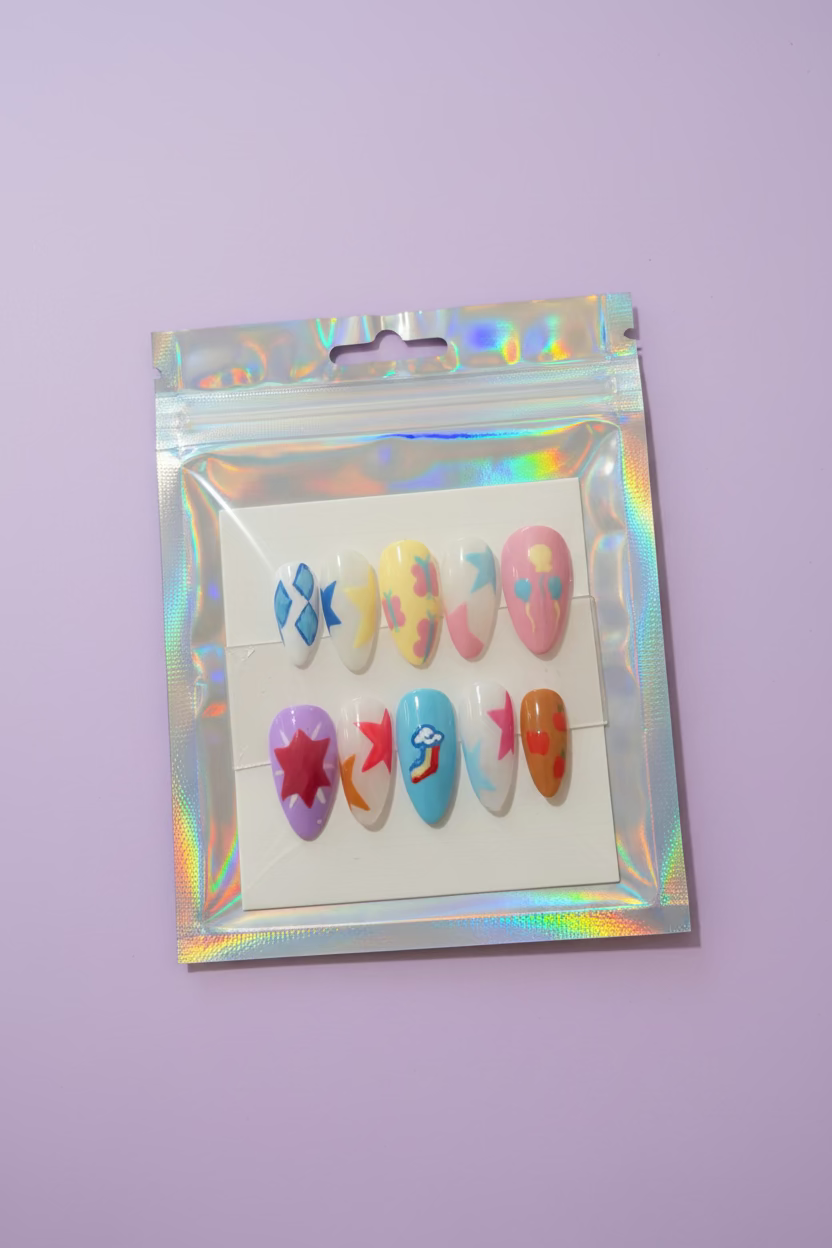 Packaged colorful nail art designs on a wooden surface